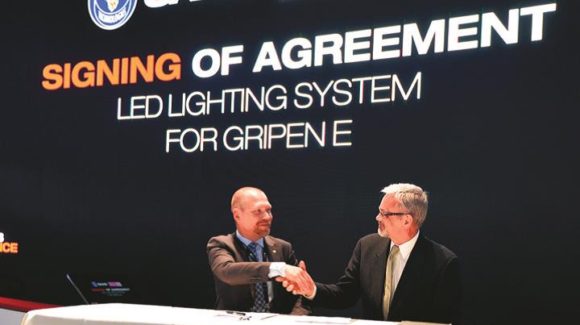 Johan Falk of Saab and Martin Blakstad of Oxley sign the agreement