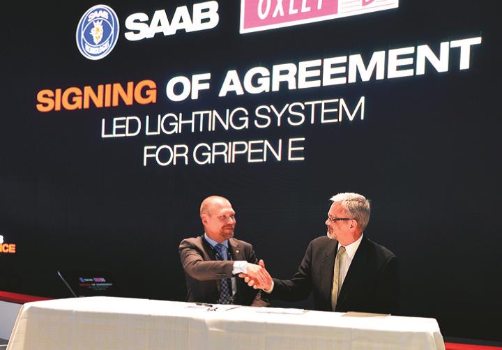 Johan Falk of Saab and Martin Blakstad of Oxley sign the agreement