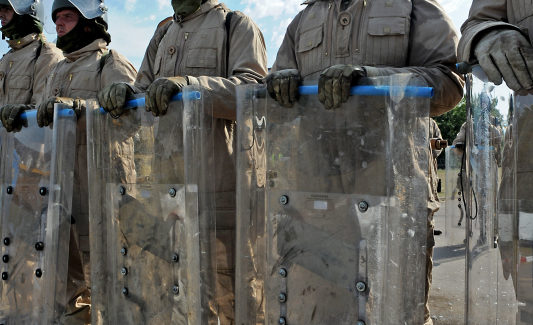 Pictured are members of 2 LANCS acting as civilian rioters facing the reserve soldiers from 4 LANCS during Public Order drills. 4th Battalion Duke of Lancaster's Regt. are now going through the final stages of their validation training in readiness to deploy to Cyprus on Operation TOSCA. Op TOSCA is a six-month long mission to maintain the status quo, peace and security along the buffer zone or Green Line which separates the Turkish north from the Greek south in Cyprus which was annexed in 1974.