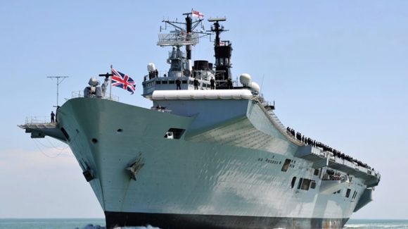 The Royal Navy's former aircraft carrier Illustrious is leaves Portsmouth to allow the UK's biggest ever warship, HMS Queen Elizabeth into port.