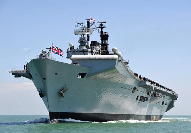 The Royal Navy's former aircraft carrier Illustrious is leaves Portsmouth to allow the UK's biggest ever warship, HMS Queen Elizabeth into port.