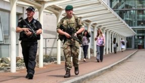 Picture shows a Army Commando (right) and police officer (left) on a security patrol at MoD Abbey Wood.