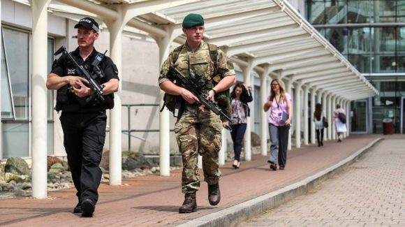 Picture shows a Army Commando (right) and police officer (left) on a security patrol at MoD Abbey Wood.