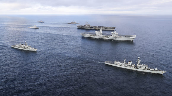 HMS Queen Elizabeth joined a carrier strike group ahead of her much-anticipated first entry into her new home port in Portsmouth. 