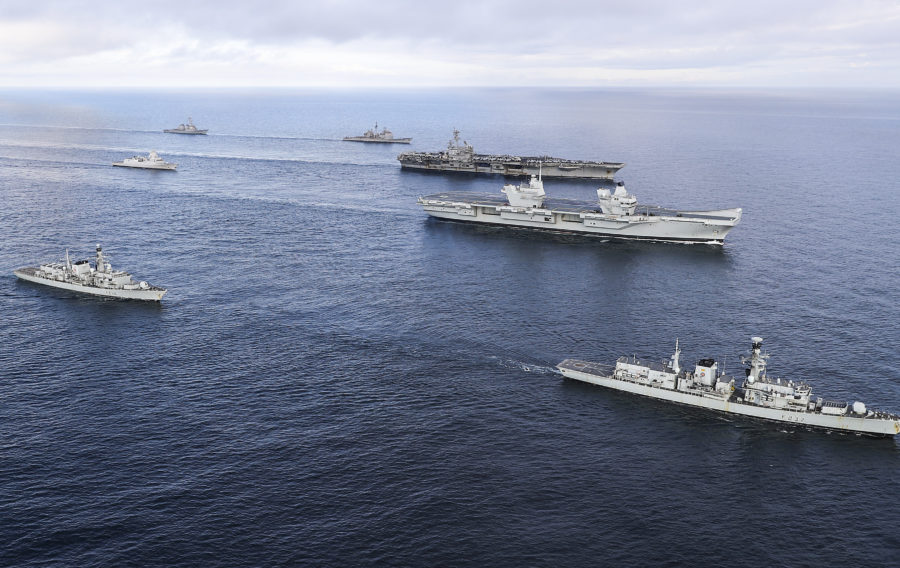 HMS Queen Elizabeth joined a carrier strike group ahead of her much-anticipated first entry into her new home port in Portsmouth. 