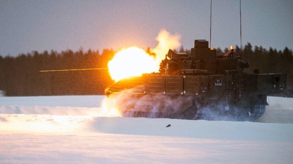 The Ajax firing and moving in extreme weather conditions in Sweden. MOD Crown Copyright 2024.