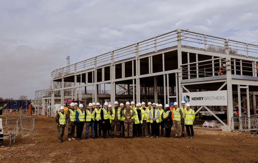 Contractor Henry Brothers Construction has held a topping out ceremony to mark a key stage in the project to deliver new facilities at Beacon Barracks in Staffordshire for 280 (NATO) Signal Squadron.