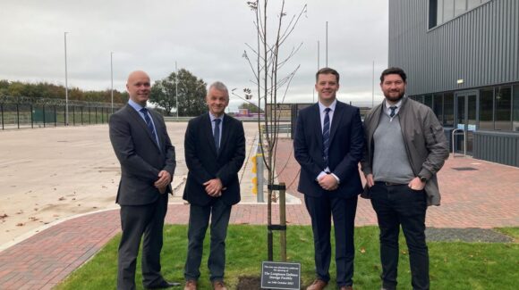 Official opening Minister for Defence Readiness and Industry (MinDRI) Luke Pollard MP has officially opened the new DE&S Longtown Defence Storage Facility (LDSF) in Cumbria, marking a significant milestone in modernising and streamlining the UK's defence logistics infrastructure. During his visit, the Minister received a first-hand look at how modern infrastructure supports military readiness. He toured the cutting-edge facility and met with some of the 25 new permanent colleagues involved in managing mission-critical defence equipment and supplies for those on the frontline. The event also included a plaque reveal and a tree planting ceremony to mark the opening. The build project, awarded by DE&S and managed by construction and civil engineering company McLaughlin & Harvey was delivered on time and employed more than 450 people from across the UK, including 150 in Scotland. The facility – as big as 12 football pitches, at 76,000m2 – represents a major investment in the UK's defence capabilities and demonstrates the government's commitment to ensuring the British Army, Royal Air Force and Royal Navy have the resources they need, when they need them. The Longtown facility which is run by DE&S in partnership Leidos and supply chain specialists Kuehne + Nagel, known collectively as Team Leidos, incorporates the latest storage technologies and security systems, enabling more efficient management of defence assets whilst maintaining the highest standards of protection. The site will support military operations across the UK and internationally, strengthening the nation's defence readiness. Minister for Defence Readiness and Industry, Luke Pollard MP said:  