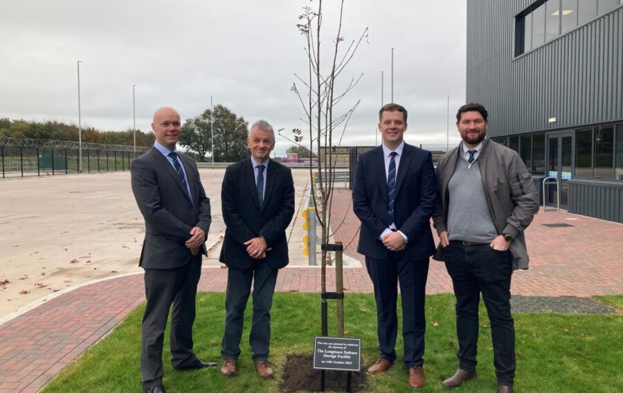 Official opening Minister for Defence Readiness and Industry (MinDRI) Luke Pollard MP has officially opened the new DE&S Longtown Defence Storage Facility (LDSF) in Cumbria, marking a significant milestone in modernising and streamlining the UK's defence logistics infrastructure. During his visit, the Minister received a first-hand look at how modern infrastructure supports military readiness. He toured the cutting-edge facility and met with some of the 25 new permanent colleagues involved in managing mission-critical defence equipment and supplies for those on the frontline. The event also included a plaque reveal and a tree planting ceremony to mark the opening. The build project, awarded by DE&S and managed by construction and civil engineering company McLaughlin & Harvey was delivered on time and employed more than 450 people from across the UK, including 150 in Scotland. The facility – as big as 12 football pitches, at 76,000m2 – represents a major investment in the UK's defence capabilities and demonstrates the government's commitment to ensuring the British Army, Royal Air Force and Royal Navy have the resources they need, when they need them. The Longtown facility which is run by DE&S in partnership Leidos and supply chain specialists Kuehne + Nagel, known collectively as Team Leidos, incorporates the latest storage technologies and security systems, enabling more efficient management of defence assets whilst maintaining the highest standards of protection. The site will support military operations across the UK and internationally, strengthening the nation's defence readiness. Minister for Defence Readiness and Industry, Luke Pollard MP said:  