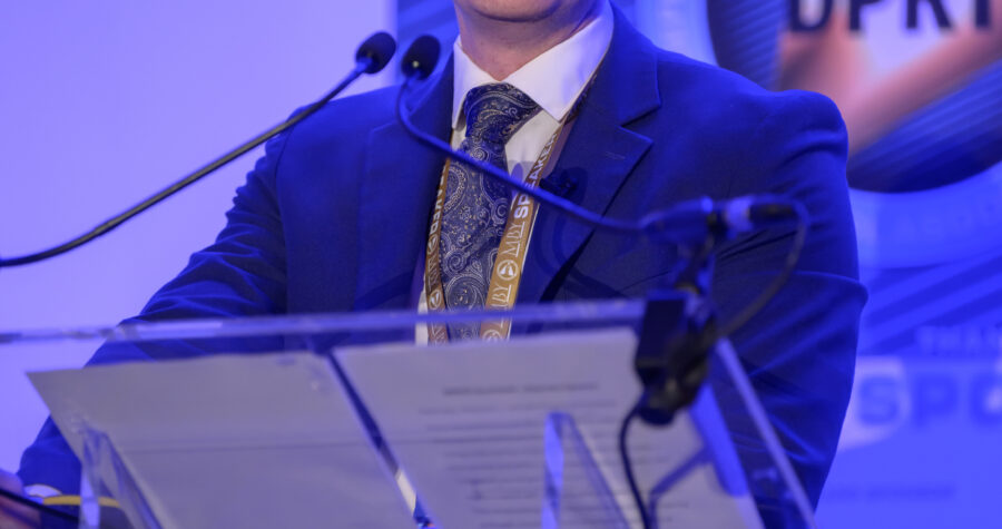 Luke Calum speaks at Glasgow hosted a defining moment for the UK defence community on 20 May as BIP Solutions, in partnership with ADS Scotland, convened the inaugural DPRTE Scottish Defence Procurement and Supply Chain Summit.
